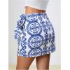 imageMilumia Womens Summer Boho Wrap Mini Skirt Allover Print High Waisted Knot Side Short Vacation Beach SkirtLight Blue
